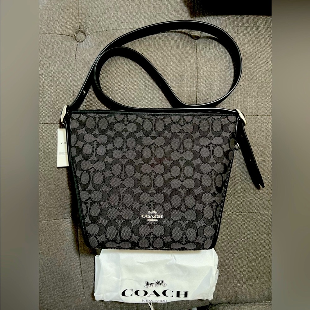 Coach Dufflette smoky black in color Jacquard signature fabric.new with tags.
